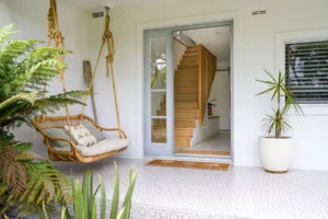 entryway with grey patterned tiling on patio