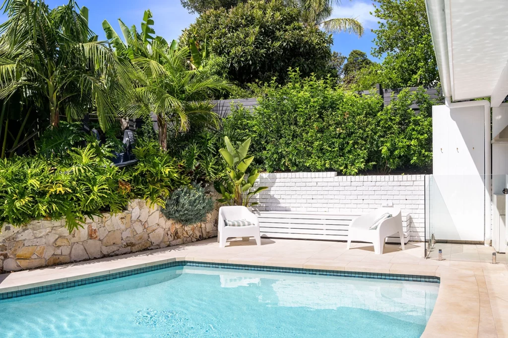 backyard outdoor area with pool and landscaping