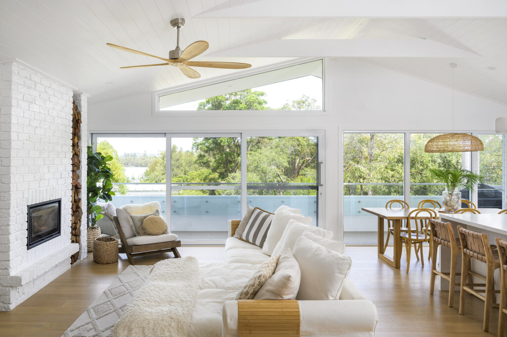 Living Room with coastal style. view of water and bushland at Wamberal